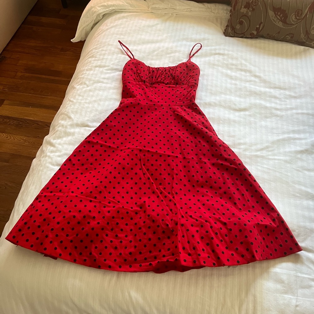 1950s style red dress with black polkadots.  Size 5.  Built in petticoat.